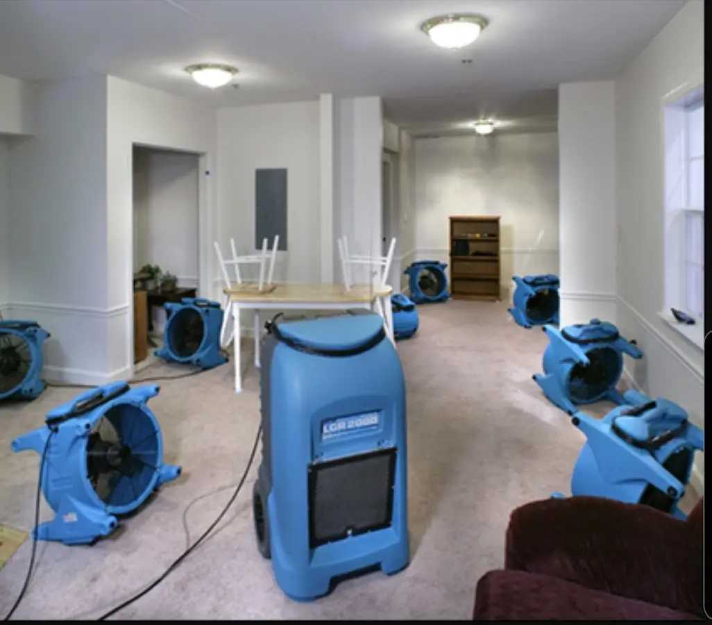 Air movers and dehumidifier setup for Water Damage Restoration in Granby